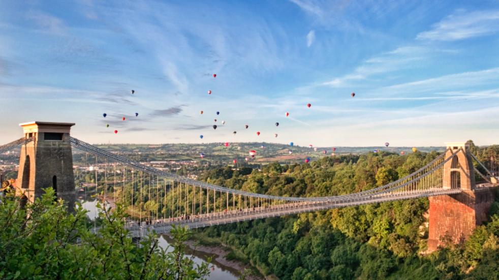 Hot air balloons behind clifton suspension bridge